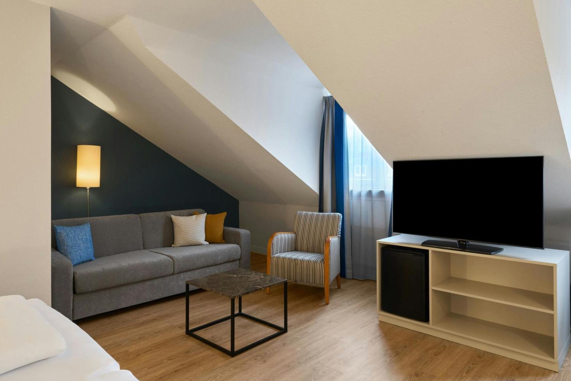 Standard Family Room with Two Single Beds and Sofa Bed